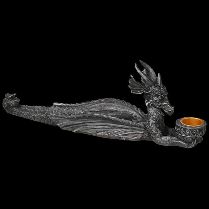 Decorative dragon figurine holding a bowl on a black background