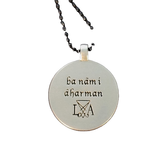 In the Name of Ahriman talismanic back of jewelry.
